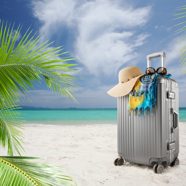 Suitcase packed on beach